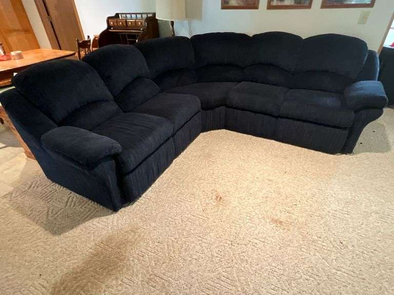 Upholstered sectional reclining sofa image