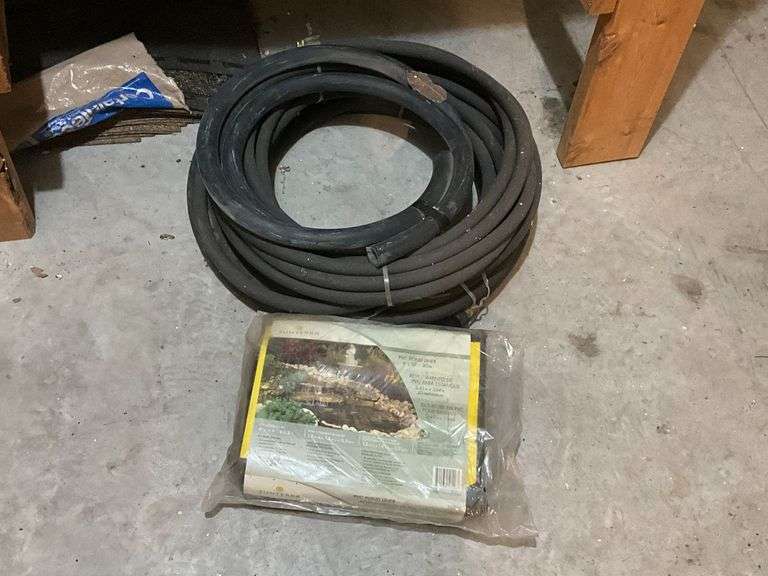 Length of soaker hose and pond liner image