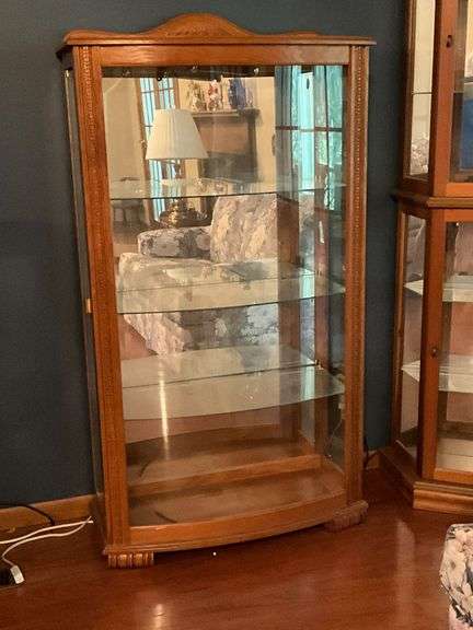 Lighted curio cabinet with glass shelves and side entry, water damage to top image