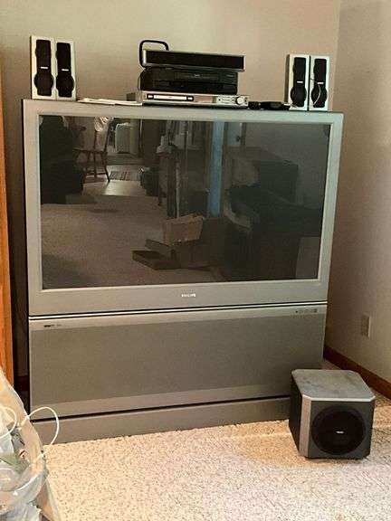 55" Philips TV and surround sound system, remotes image