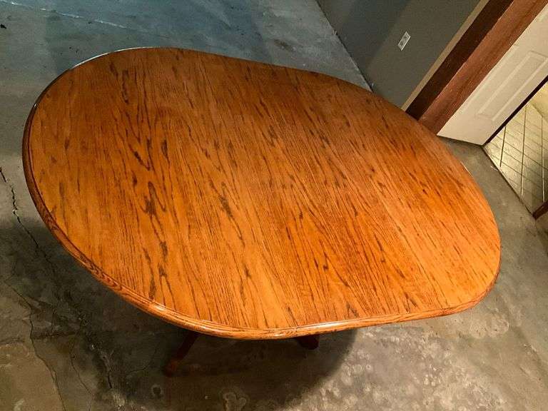 Oak dining table with one 18" leaf image