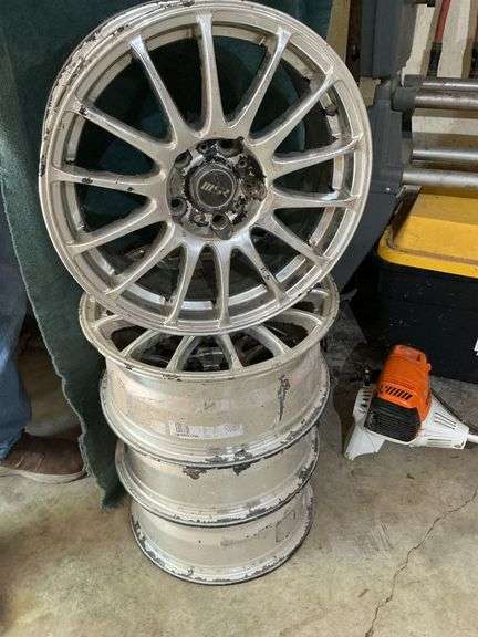4 aluminum wheels, 16 x 7, 5 on 4 1/2 bolt pattern, 35mm offset. image