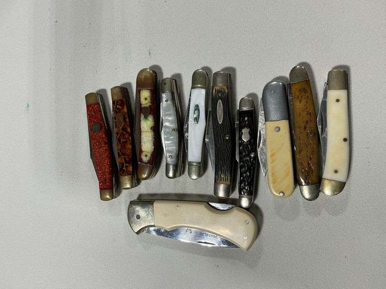 Collection of used pocket knives image