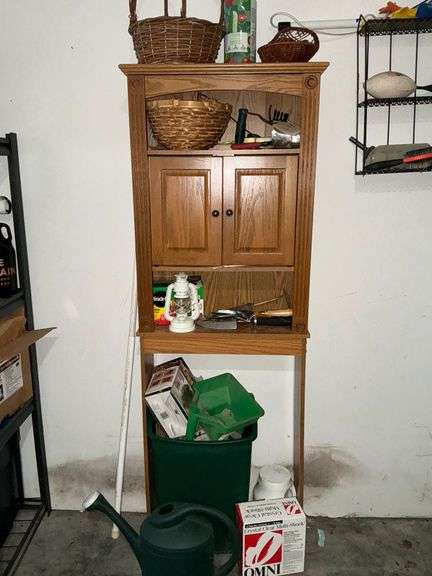 Garden supplies, baskets, over the toilet cabinet, Miracle-Gro, etc. image