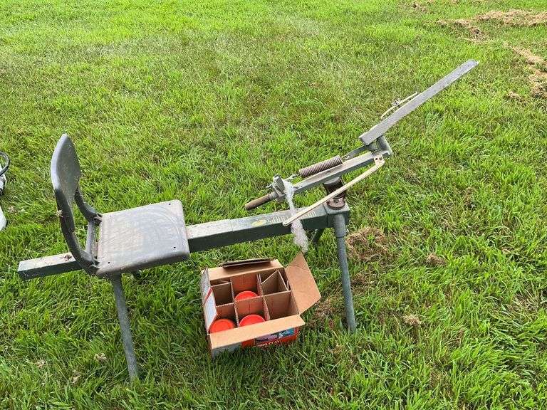 Do-All-Traps clay pigeon thrower on frame with seat image
