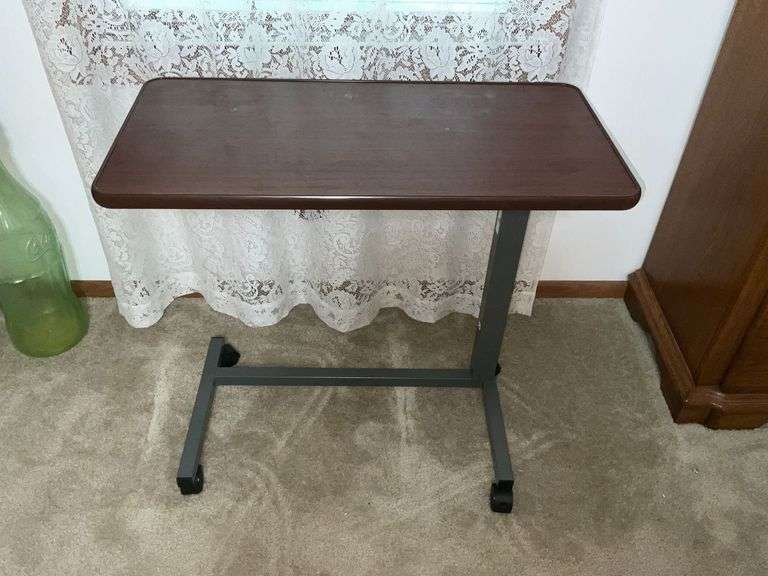 Adjustable height rolling table image
