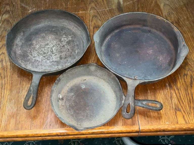 3 unmarked cast iron skillets image