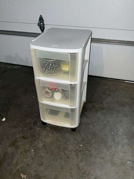 3-drawer plastic cabinet, candles and candle holders image