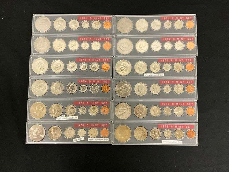 Assorted coin sets in plastic holders image