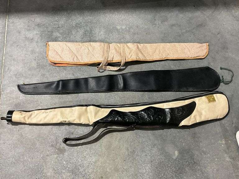 3 soft sided gun cases, one with broken zipper image
