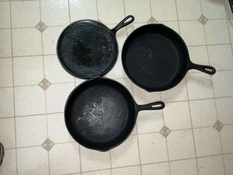 Unmarked pair of cast iron skillets image