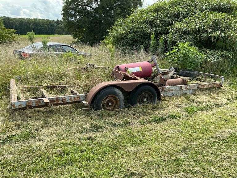 Trailer frame 82" W x 18', 3500 lb. axles, 2" ball?, wench plate, ramp storage frame image