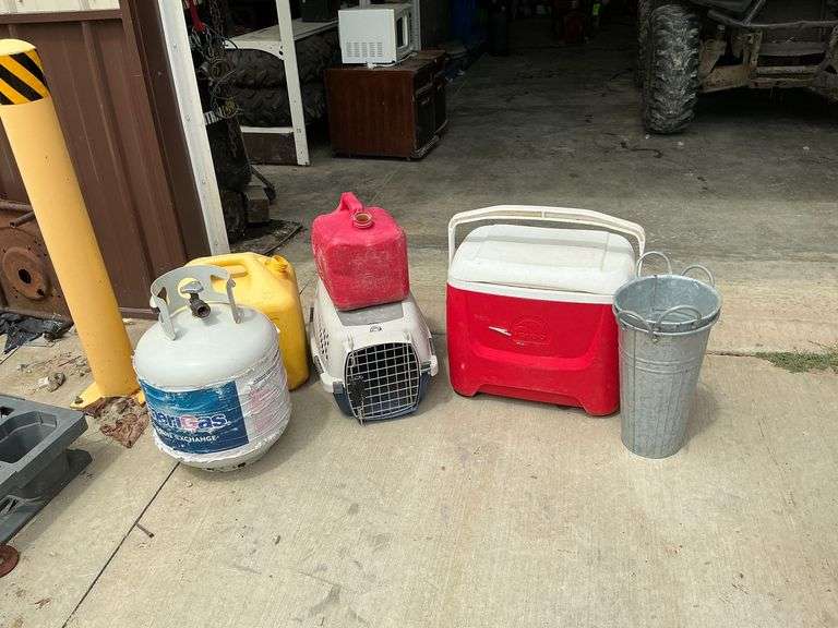Empty propane tank, cat carrier, 2 flower pots image