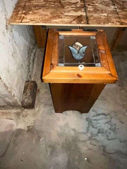 Wooden trash can with plastic painted top. image