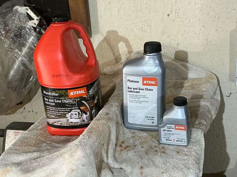 Stihl bar & chain oil, mixing oil, partial bottles. image