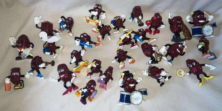 Collection of California Raisins figurines and keychains image