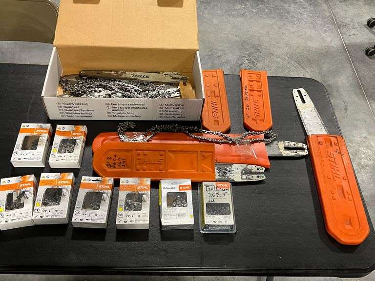 Assorted Stihl chainsaw used chains, covers, extra bars, etc. image