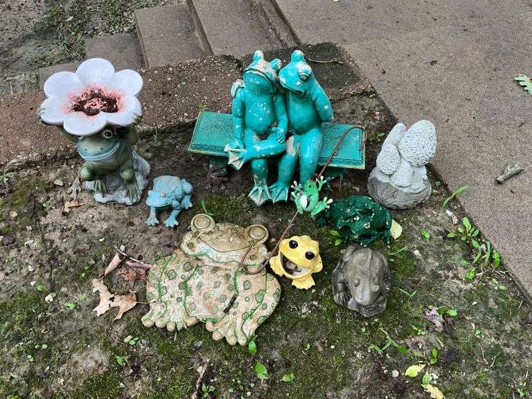 Frog and mushroom yard art, some with damage image
