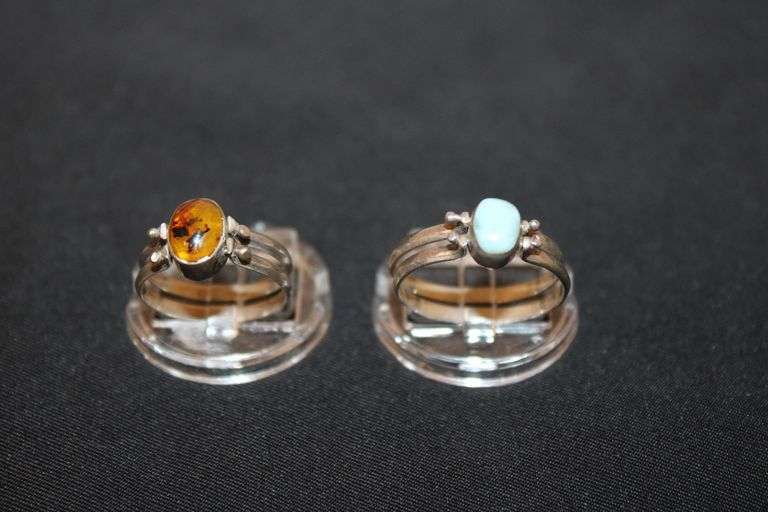 2 Convertible Sterling Silver rings. Both feature amber stones on one side (one with really good inclusions) & a light blue stone on the other side image