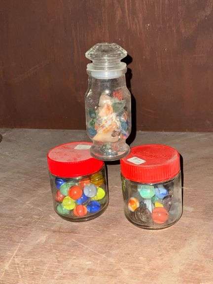 Marbles, quartz and colored glass in jars image