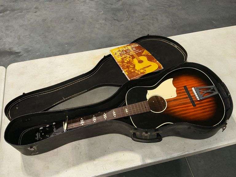 Stella Harmony guitar with capo and case image
