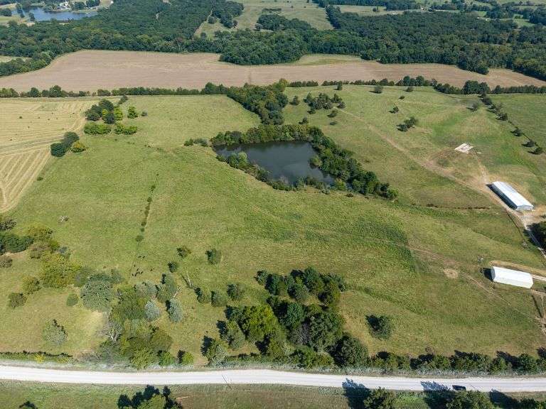 Now Absolute Sells to Highest Bidder! Eastern Boone County Land Auction – 76.06± Acres with Lake, Pond & Cedar Creek on S. Purdy Lane image