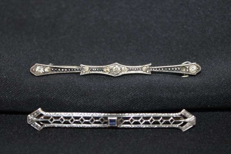 Pair of Art Deco style pins only one found with sterling silver mark. image