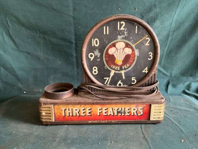 Three Feathers Distributing electric clock image
