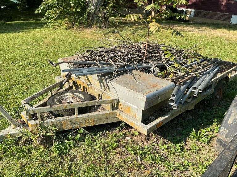 Single axle flatbed trailer, 10' L x 78" W. 12" tires, truck tool box on front, mesh floor image