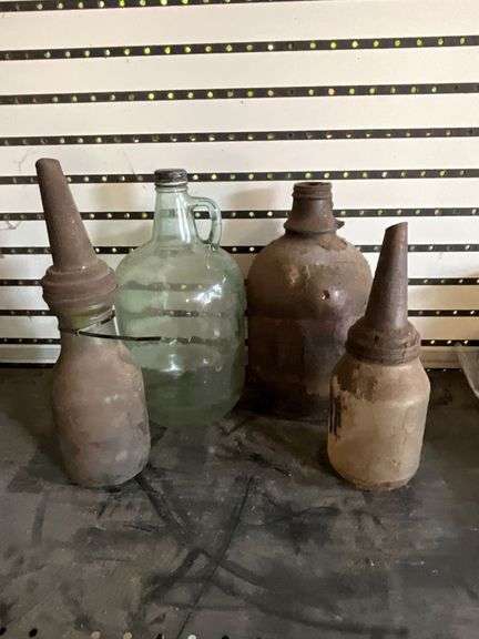 2 glass bottles with The Master Manufacturing Company spouts image