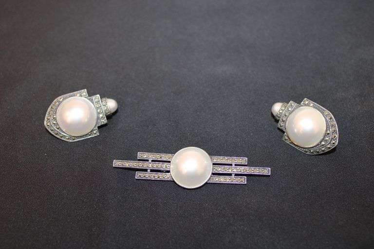 Sterling Silver pin with a set of matching earrings. image