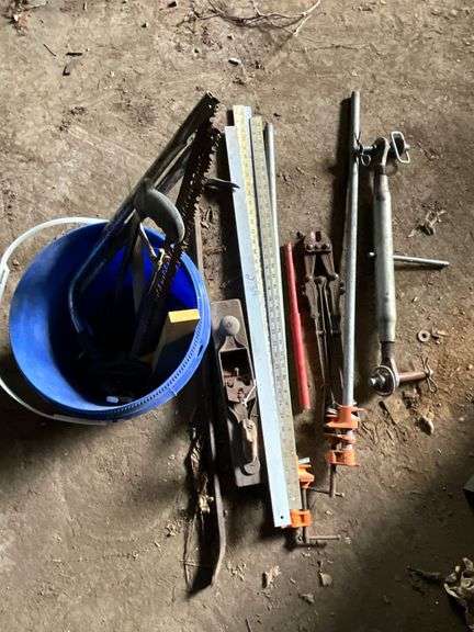Bar clamps, bolt cutters, steel yard sticks image