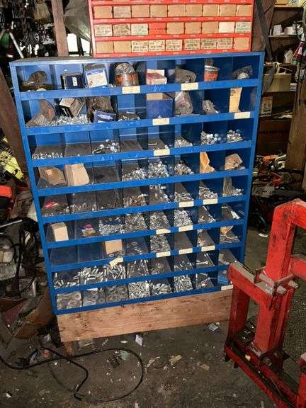 Blue metal hardware bin with contents image