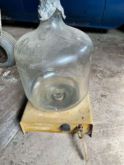 Corning glass jug with spout on metal platform image