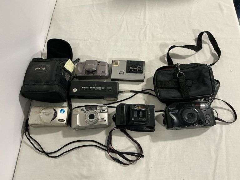 Kodak Advantix 3400 35mm camera in case, Olympus 35mm camera image