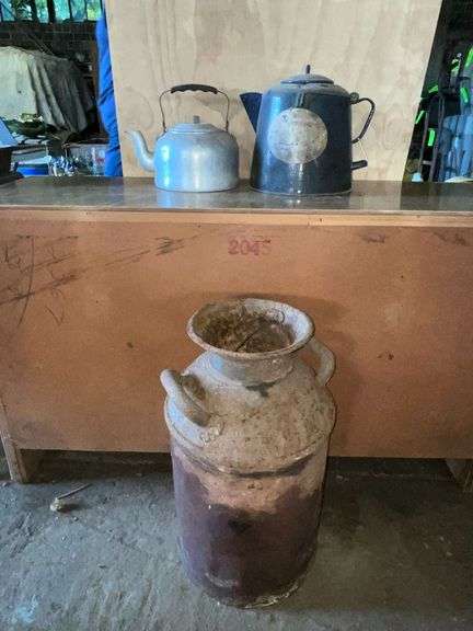 Rusty milk can, granite coffee pot (some holes) image