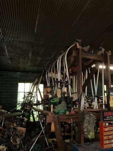 Large assortment of used weed eaters, weed eater parts, tire tubes, etc. image