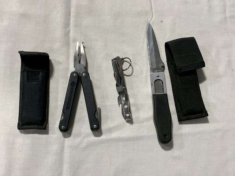 Pair of folding knives in nylon sheath image