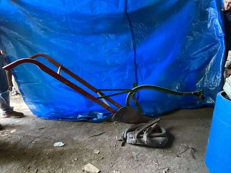 Horse drawn single bottom plow with horse collar and hames image