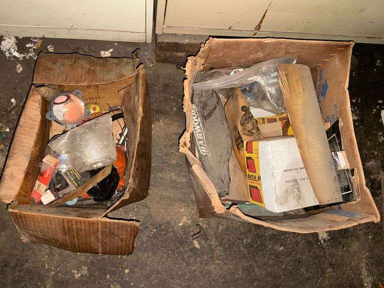 2 boxes of assorted car parts image