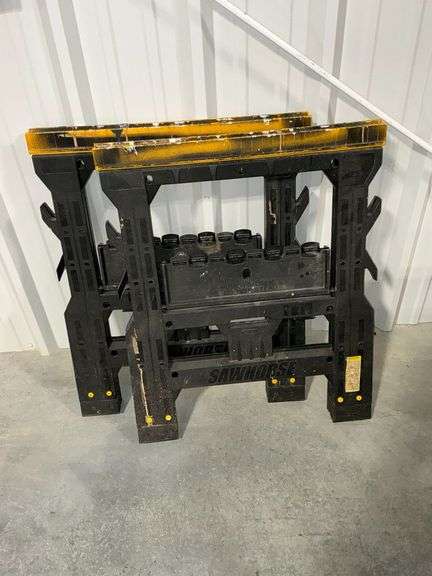 Pair of plastic folding sawhorses image