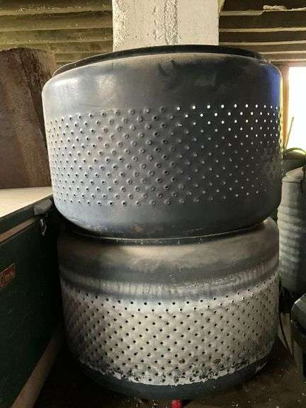 Pair of metal washing machine tubs image