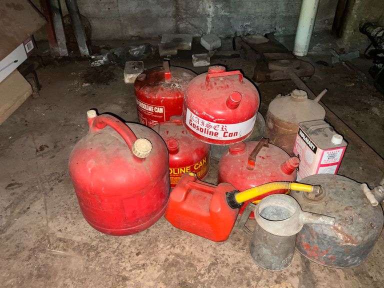 Assorted gas cans and floor jack image