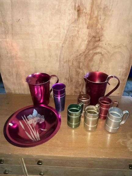 2 colored aluminum pitchers image
