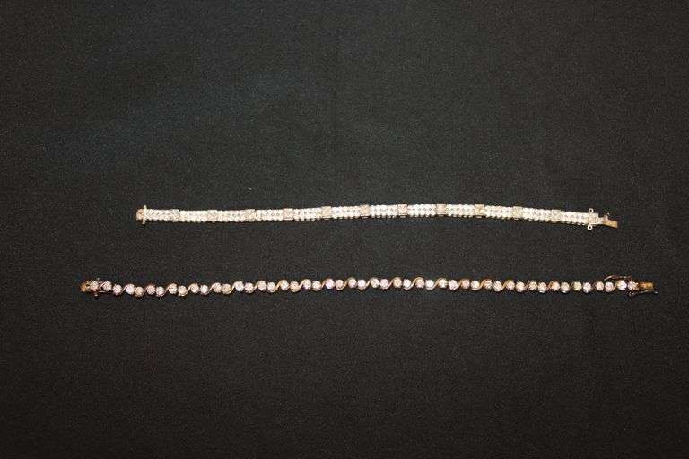 7" and 8 1/2" sterling silver tennis bracelets. image