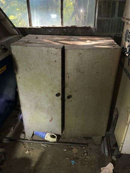 Vintage metal parts cabinet on legs with contents, dent in top image