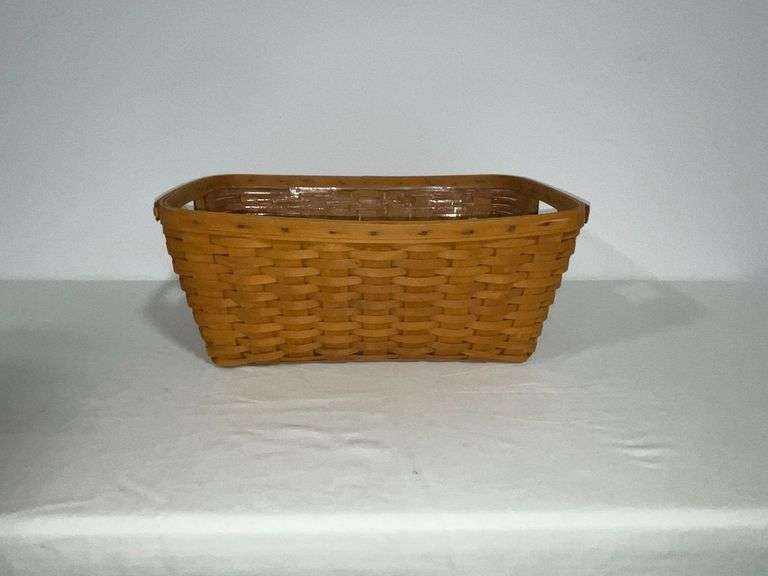 1996 Longaberger laundry basket with plastic liner image
