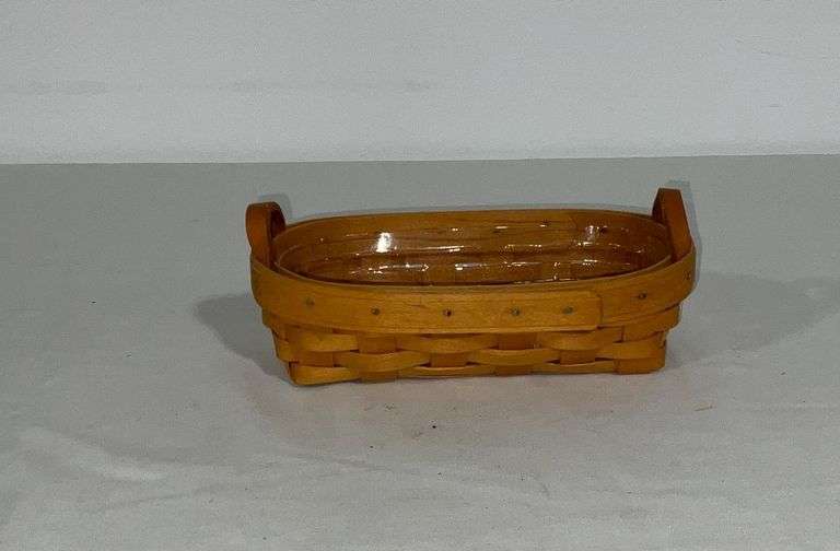 1998 Longaberger cracker basket with plastic liner and leather handles image