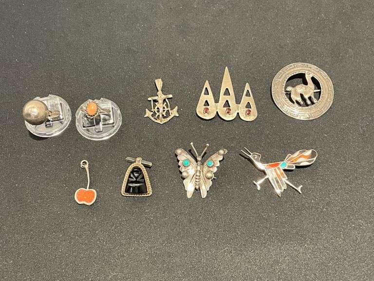 Pins, pendants, cufflink, pair of rings.  Possibly silver, but no marks found. image