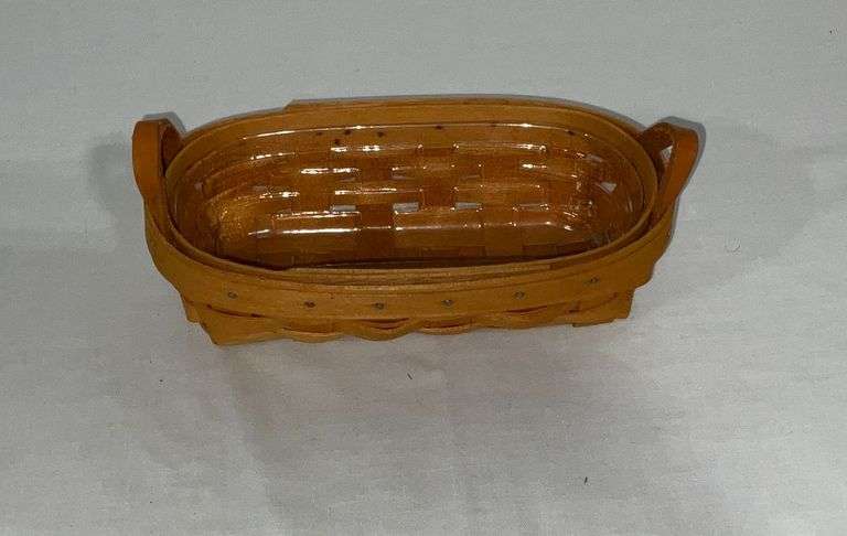 1999 Longaberger cracker basket with plastic liner and leather handles image